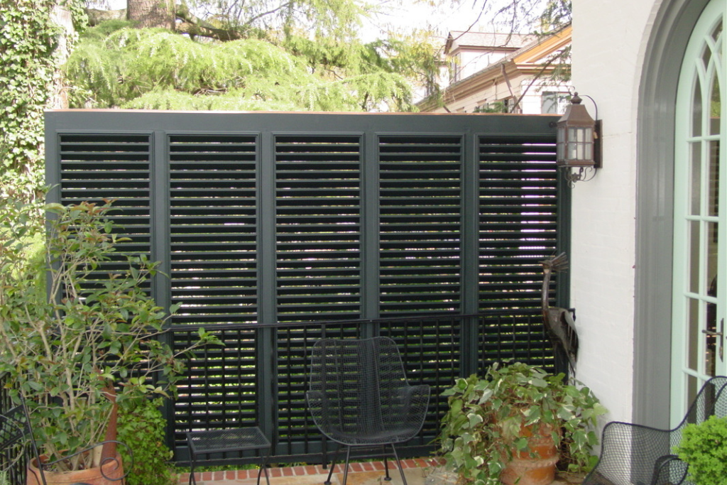 Bahama shutters as an outdoor patio privacy wall