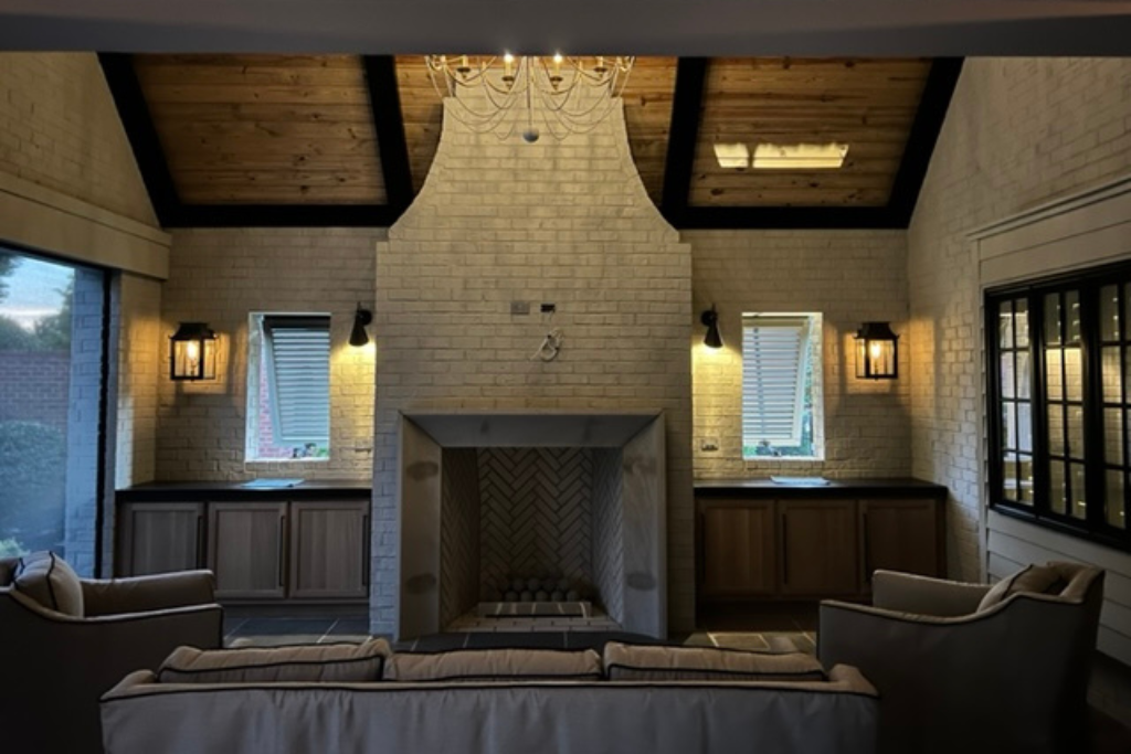 Outdoor living area with chimney and Bermuda shutters