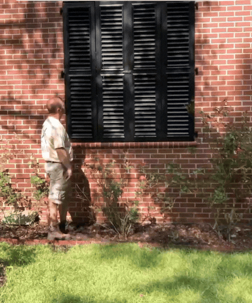 Adam demonstrating a fully functioning shutter by unlocking and opening the shutters. 